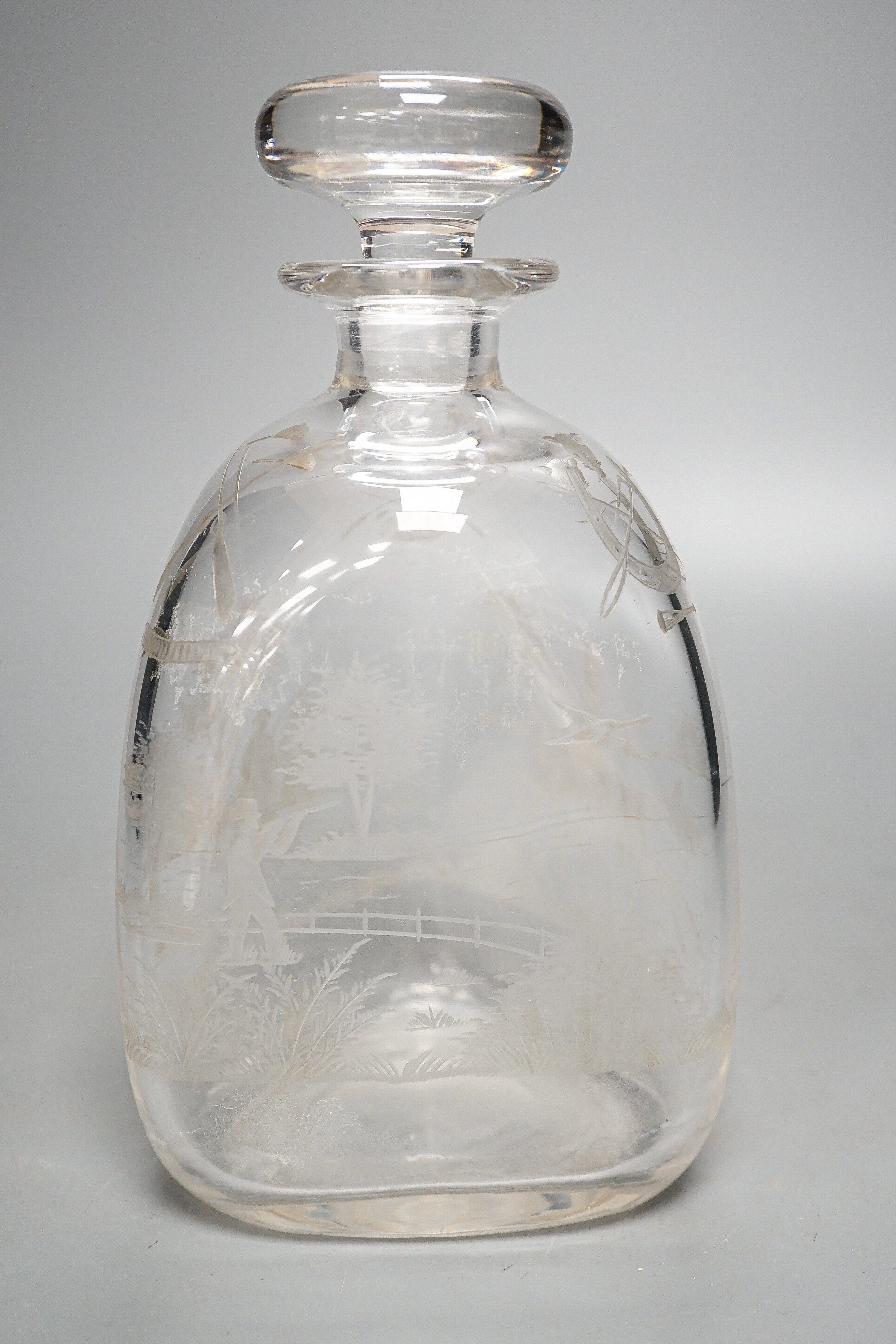 Hunting interest - A Victorian wheel engraved triangular glass decanter, and stopper, 22 cms high.